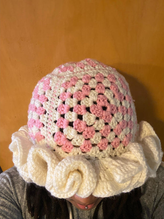 Crocheted Granny square hat with ruffled rim